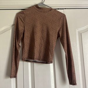 Half cropped, long sleeve, and cheetah print.